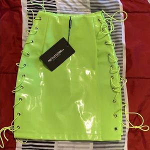 PrettyLittleThing neon lace up skirt.